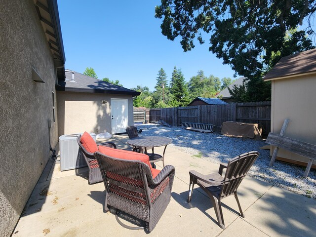 3621 Sacramento Dr, Redding, CA 96001 - fenced backyard with a patio and outdoor dining space