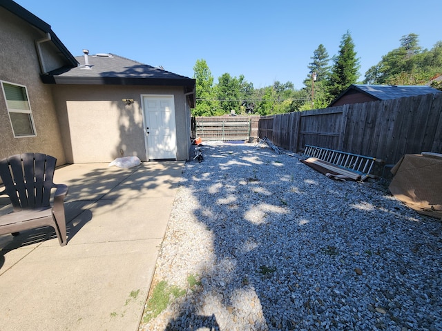 3621 Sacramento Dr, Redding, CA 96001 - fenced backyard with a patio area