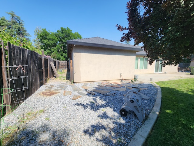 3621 Sacramento Dr, Redding, CA 96001 - view of home's exterior with stucco siding and a patio area