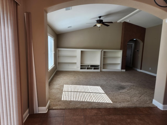 3621 Sacramento Dr, Redding, CA 96001 - unfurnished living room featuring arched walkways, carpet, a ceiling fan, and vaulted ceiling
