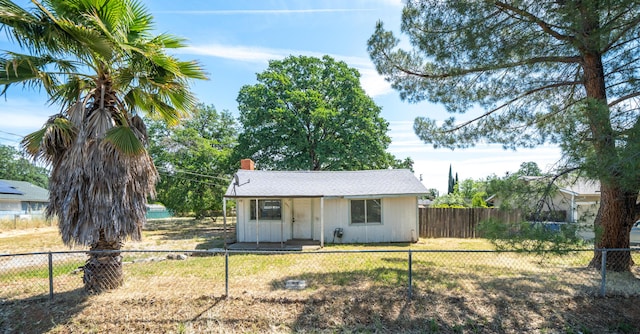 2631 Irwin Rd, Redding, CA 96002 - view of front of property with a chimney, board and batten siding, and an outbuilding