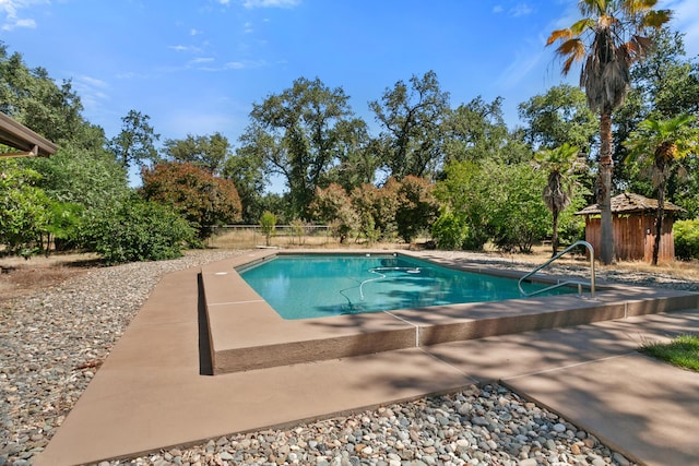 5165 Rancho Vista Way, Redding, CA 96002 - view of pool with fence, view of scattered trees, and a patio area