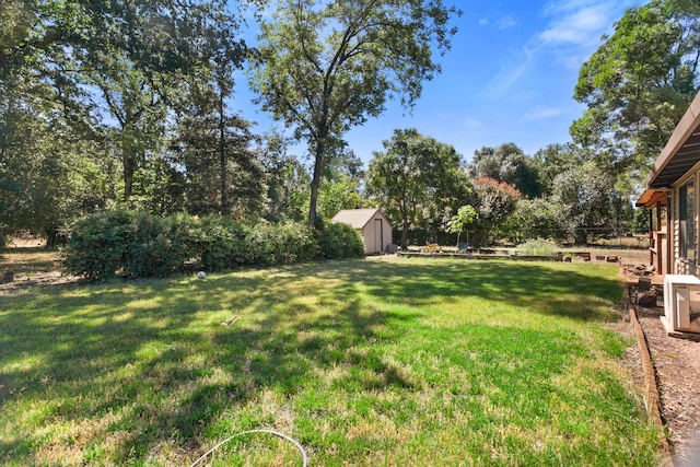 5165 Rancho Vista Way, Redding, CA 96002 - view of grassy yard with a storage unit and an outdoor structure