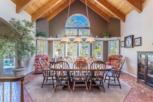 17917 Lakeshore Dr, Weed, CA 96094 - dining room featuring wood ceiling, high vaulted ceiling, baseboards, arched walkways, and beam ceiling