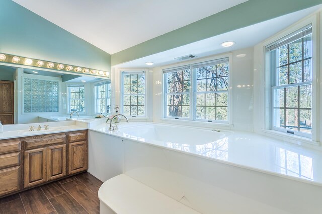 17917 Lakeshore Dr, Weed, CA 96094 - full bathroom with a bath, wood finished floors, vaulted ceiling, recessed lighting, and vanity