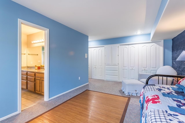 17917 Lakeshore Dr, Weed, CA 96094 - bedroom featuring light colored carpet, ensuite bath, and baseboards