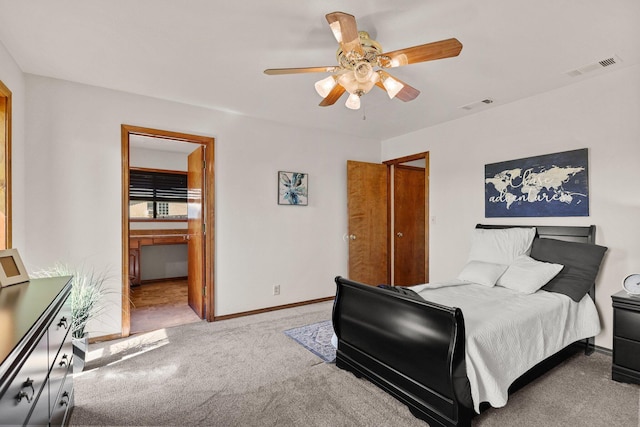 carpeted bedroom with baseboards, ceiling fan, and connected bathroom