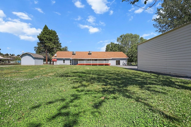 rear view of house with a lawn