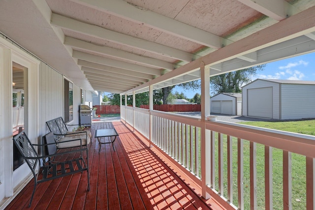 deck with an outdoor structure and a shed