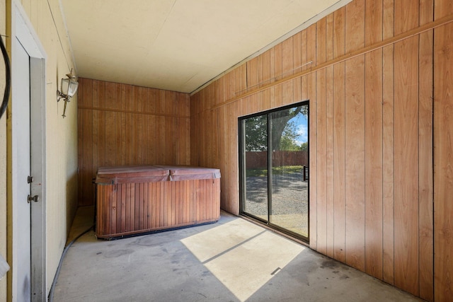 unfurnished sunroom with a jacuzzi