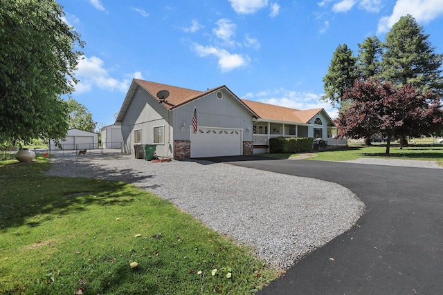 view of front of home featuring asphalt driveway, brick siding, an attached garage, and roof with shingles