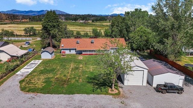 aerial view of property and surrounding area with a mountainous background