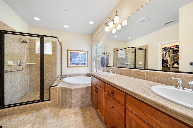 792 Bellagio, Redding, CA 96003 - full bath featuring a shower stall, a garden tub, a walk in closet, double vanity, and recessed lighting