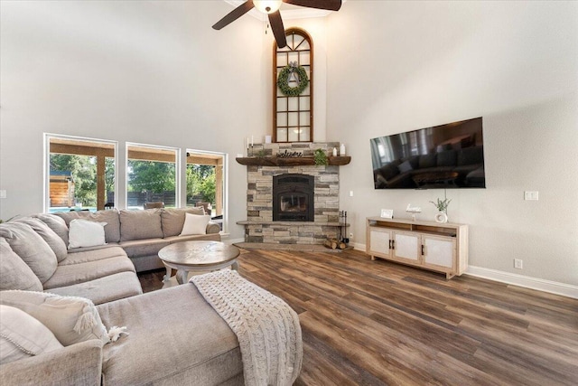 20030 Clay Ct, Cottonwood, CA 96022 - living area featuring a ceiling fan, baseboards, wood finished floors, a fireplace, and a high ceiling