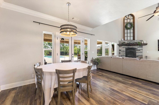 20030 Clay Ct, Cottonwood, CA 96022 - dining space featuring baseboards, wood finished floors, french doors, a chandelier, and a stone fireplace