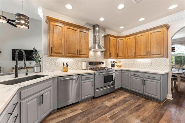 20030 Clay Ct, Cottonwood, CA 96022 - kitchen with stainless steel appliances, gray cabinetry, a sink, wall chimney range hood, and dark wood-style floors