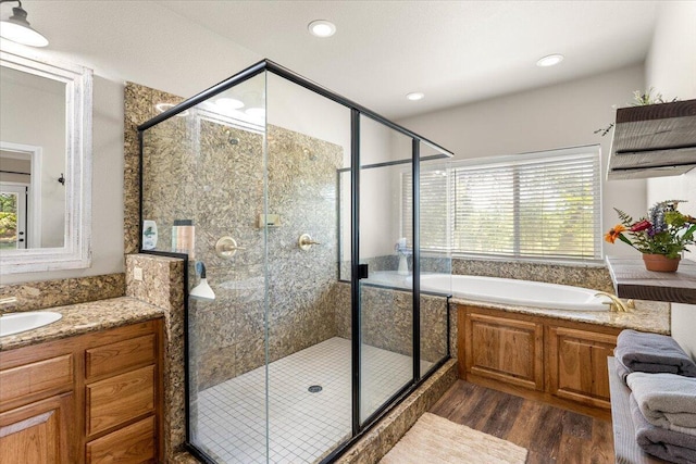 20030 Clay Ct, Cottonwood, CA 96022 - bathroom featuring wood finished floors, a bath, a stall shower, and recessed lighting