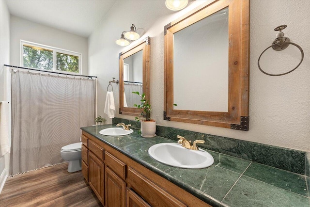 20030 Clay Ct, Cottonwood, CA 96022 - full bathroom featuring wood finished floors, toilet, double vanity, a shower with curtain, and a textured wall