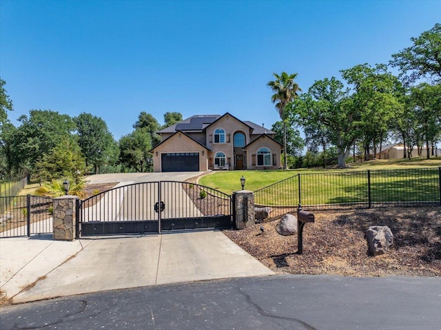 20030 Clay Ct, Cottonwood, CA 96022 - view of front of home featuring a gate, concrete driveway, stucco siding, a garage, and roof mounted solar panels