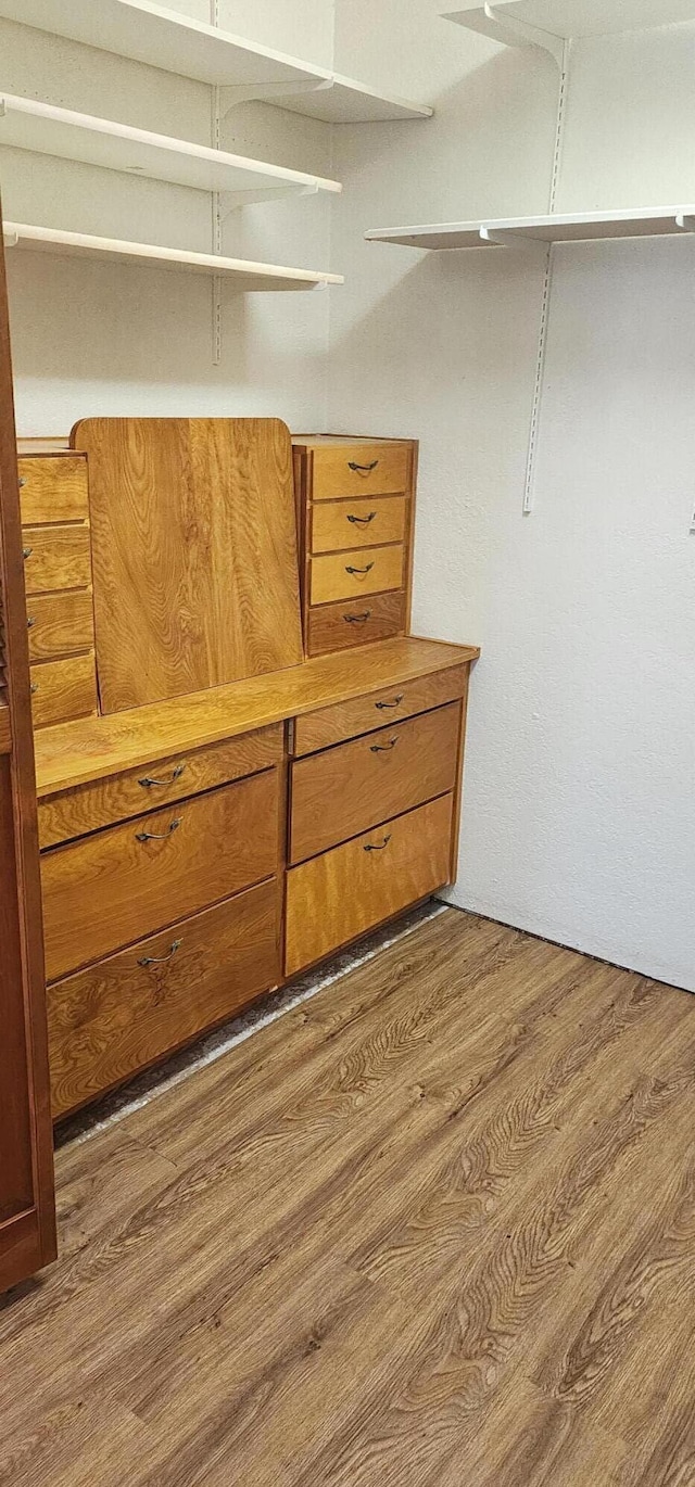 7670 Cedar Crest Rd, Shingletown, CA 96088 - walk in closet featuring dark wood-style flooring