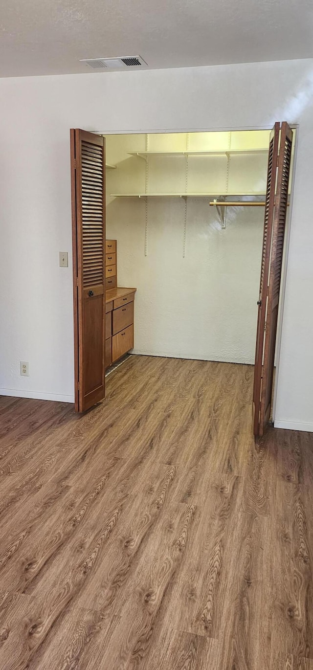 7670 Cedar Crest Rd, Shingletown, CA 96088 - unfurnished bedroom featuring wood finished floors and a closet