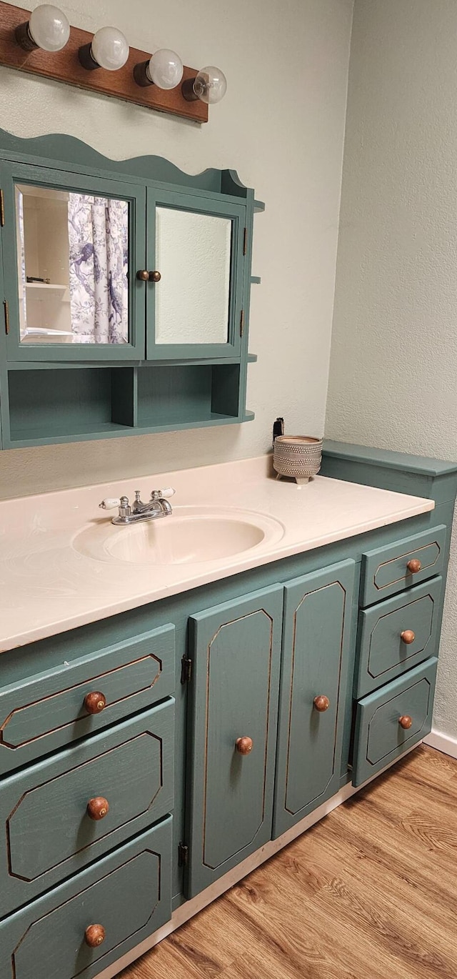 7670 Cedar Crest Rd, Shingletown, CA 96088 - bathroom featuring vanity and wood finished floors
