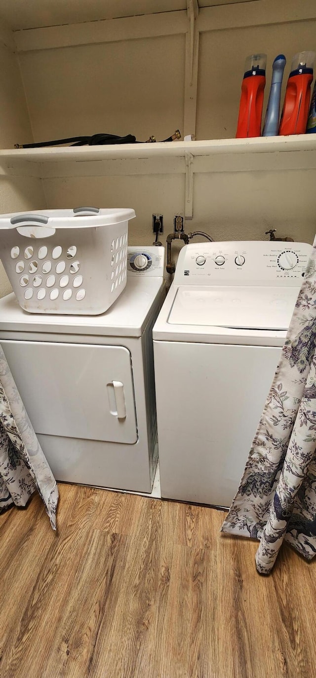 7670 Cedar Crest Rd, Shingletown, CA 96088 - laundry area featuring wood finished floors and washing machine and clothes dryer