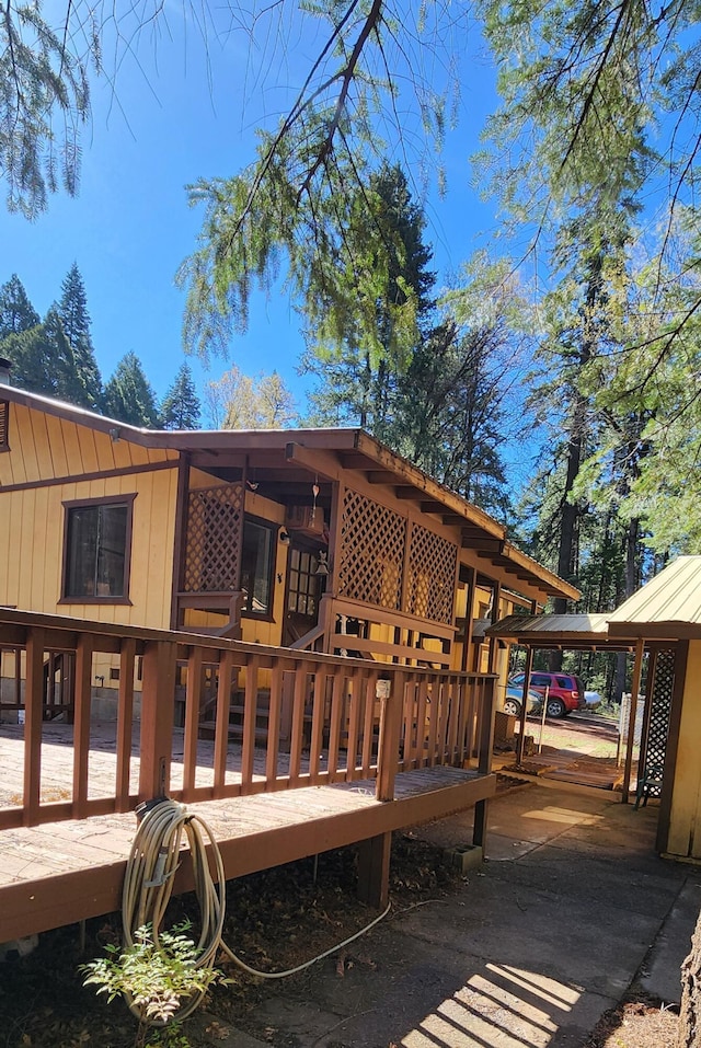 7670 Cedar Crest Rd, Shingletown, CA 96088 - back of property with a wooden deck