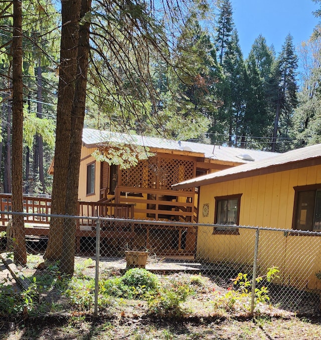 7670 Cedar Crest Rd, Shingletown, CA 96088 - back of property featuring a deck and metal roof