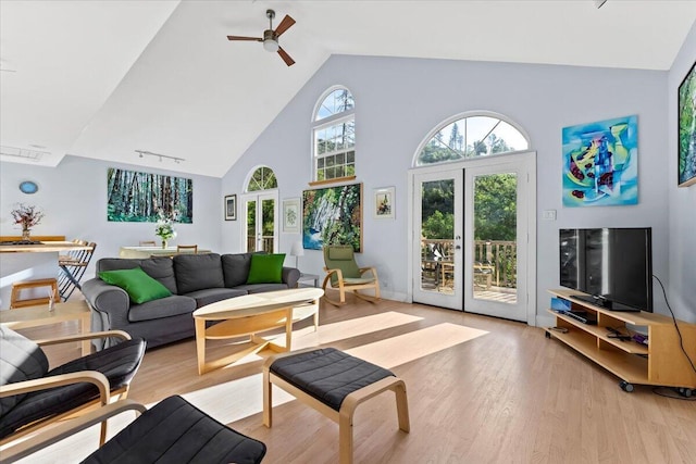 12876 E Fork Rd, French Gulch, CA 96033 - living room featuring high vaulted ceiling, light wood-style flooring, ceiling fan, and french doors