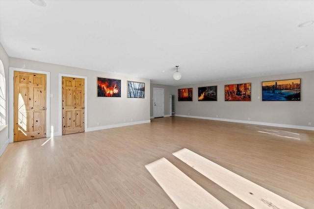 12876 E Fork Rd, French Gulch, CA 96033 - unfurnished living room with light wood finished floors, baseboards, and stairway