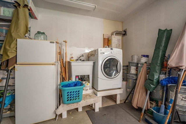 12876 E Fork Rd, French Gulch, CA 96033 - clothes washing area with washer / dryer and water heater