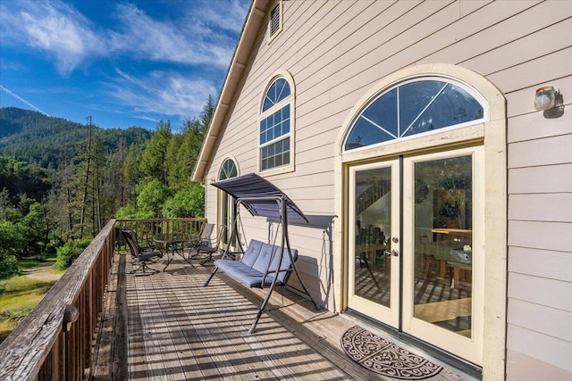 12876 E Fork Rd, French Gulch, CA 96033 - balcony featuring a wooded view