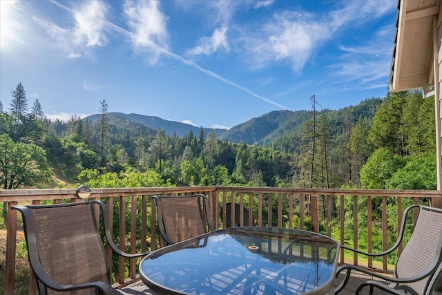 12876 E Fork Rd, French Gulch, CA 96033 - balcony with a view of trees, outdoor dining area, and a mountain view