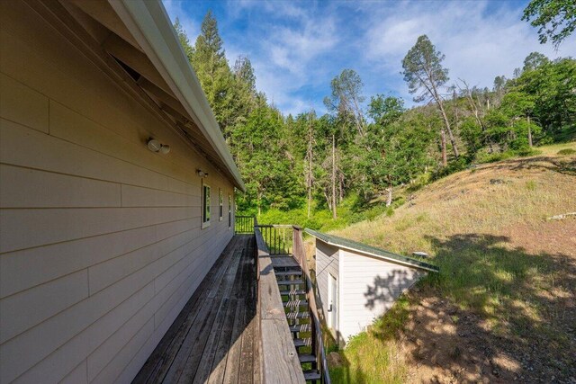 12876 E Fork Rd, French Gulch, CA 96033 - view of side of home featuring stairway and a wooded view