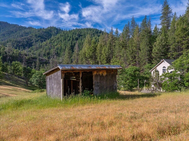 12876 E Fork Rd, French Gulch, CA 96033 - view of pole building with a wooded view and a mountain view