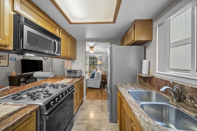 200 Ridgetop Dr # 26, Redding, CA 96003 - kitchen featuring stainless steel appliances, a sink, and brown cabinets