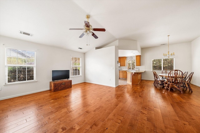 117 Yolla Bolly Trl, Redding, CA 96003 - living room with ceiling fan, lofted ceiling, light wood-style flooring, a chandelier, and baseboards