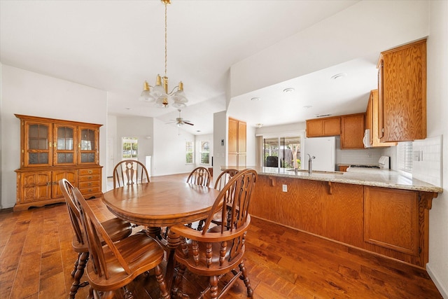 117 Yolla Bolly Trl, Redding, CA 96003 - dining room with dark wood finished floors, a chandelier, and a ceiling fan