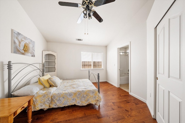 117 Yolla Bolly Trl, Redding, CA 96003 - bedroom with wood finished floors, baseboards, ensuite bathroom, ceiling fan, and vaulted ceiling