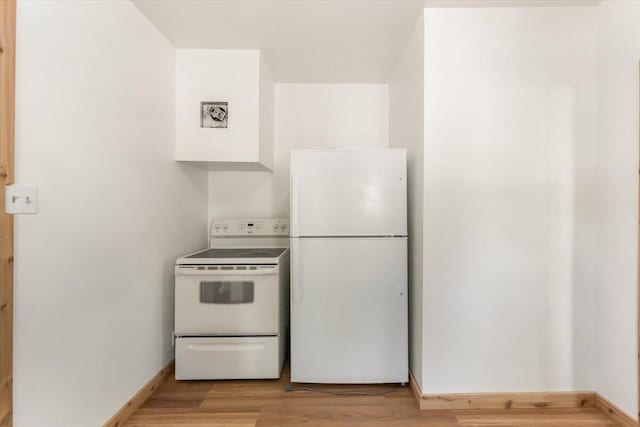 5985 Dunsmuir Ave, Dunsmuir, CA 96025 - kitchen featuring white appliances, light wood-style flooring, and baseboards