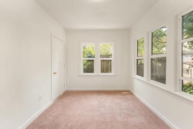 5985 Dunsmuir Ave, Dunsmuir, CA 96025 - empty room featuring plenty of natural light, light colored carpet, and baseboards