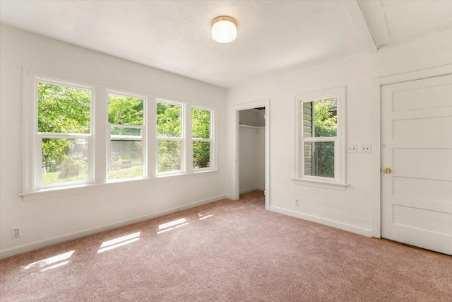 5985 Dunsmuir Ave, Dunsmuir, CA 96025 - unfurnished bedroom with multiple windows, baseboards, light colored carpet, and a closet