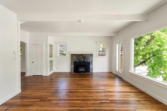 5985 Dunsmuir Ave, Dunsmuir, CA 96025 - unfurnished living room with healthy amount of natural light, wood finished floors, a fireplace, baseboards, and beamed ceiling