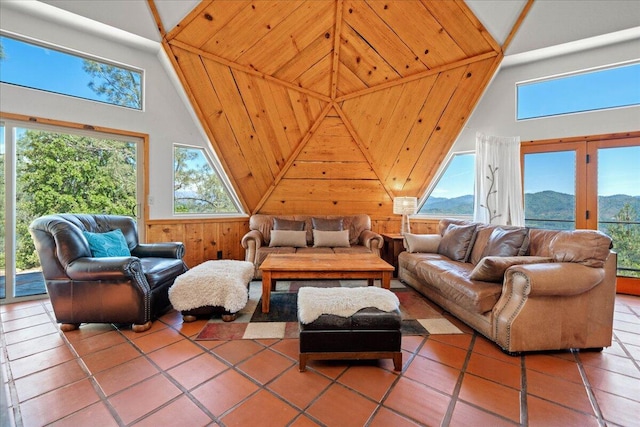 19028 Rocky Trl, Lakehead, CA 96051 - living area featuring lofted ceiling, tile patterned floors, wood walls, and a mountain view