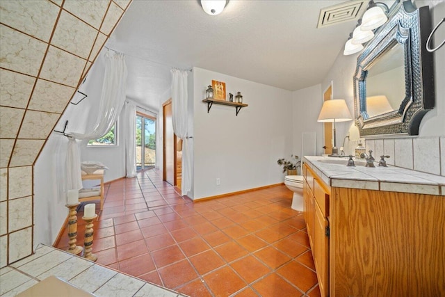19028 Rocky Trl, Lakehead, CA 96051 - bathroom with tile patterned flooring, toilet, baseboards, and vanity
