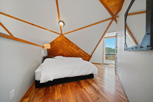 19028 Rocky Trl, Lakehead, CA 96051 - bedroom featuring wood finished floors, access to outside, and vaulted ceiling