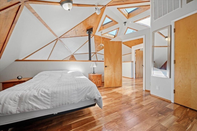 19028 Rocky Trl, Lakehead, CA 96051 - bedroom featuring wood finished floors and high vaulted ceiling