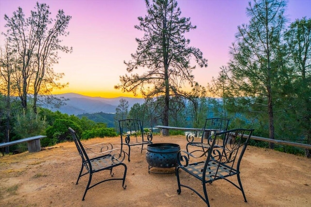 19028 Rocky Trl, Lakehead, CA 96051 - view of patio with a mountain view and an outdoor fire pit