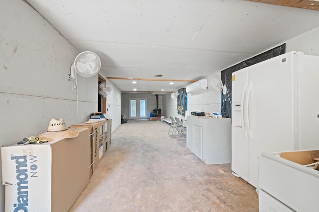 13599 Oak Run Rd, Oak Run, CA 96069 - below grade area featuring a wall mounted air conditioner and white refrigerator with ice dispenser